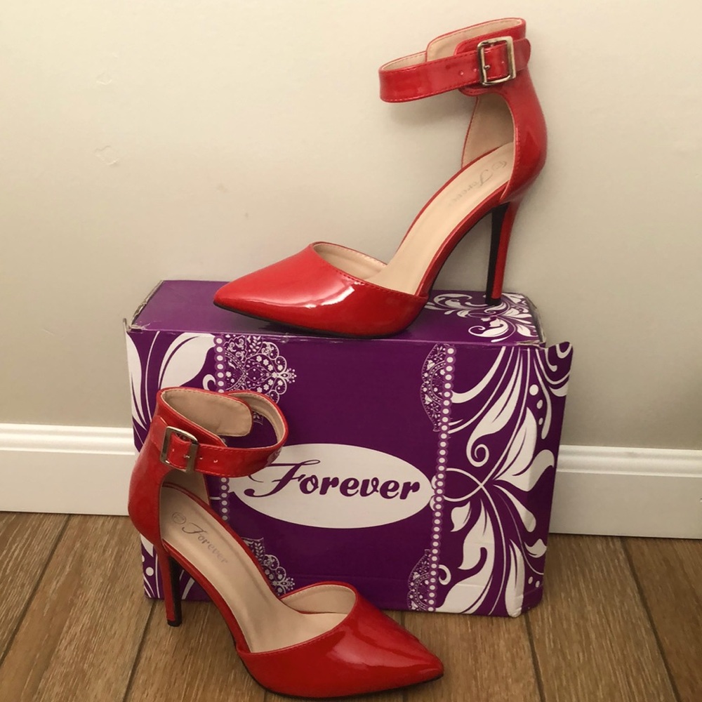 Red patent leather high heels with buckled strap